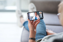 photo of a person during a telehealth session on a smartphone