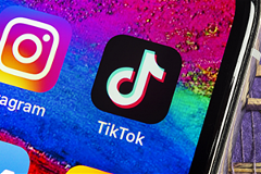 image of a TikTok icon on a smartphone screen