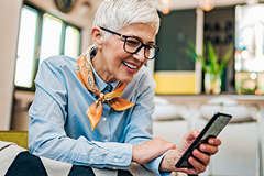 photo of a woman watching a video on her smartphone