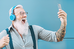 photo of a senior man looking at a smartphone