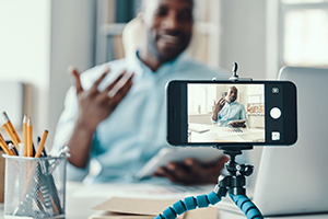 social-media-videos photo of a person watching a video on a smartphone