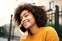 photo of a young woman talking on a cell phone