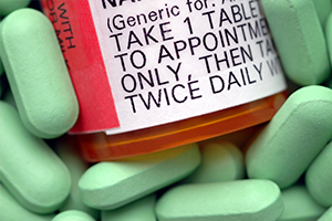 photo of a medicine bottle surrounded by pills