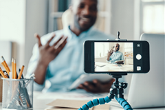 photo of a person watching a video on a smartphone